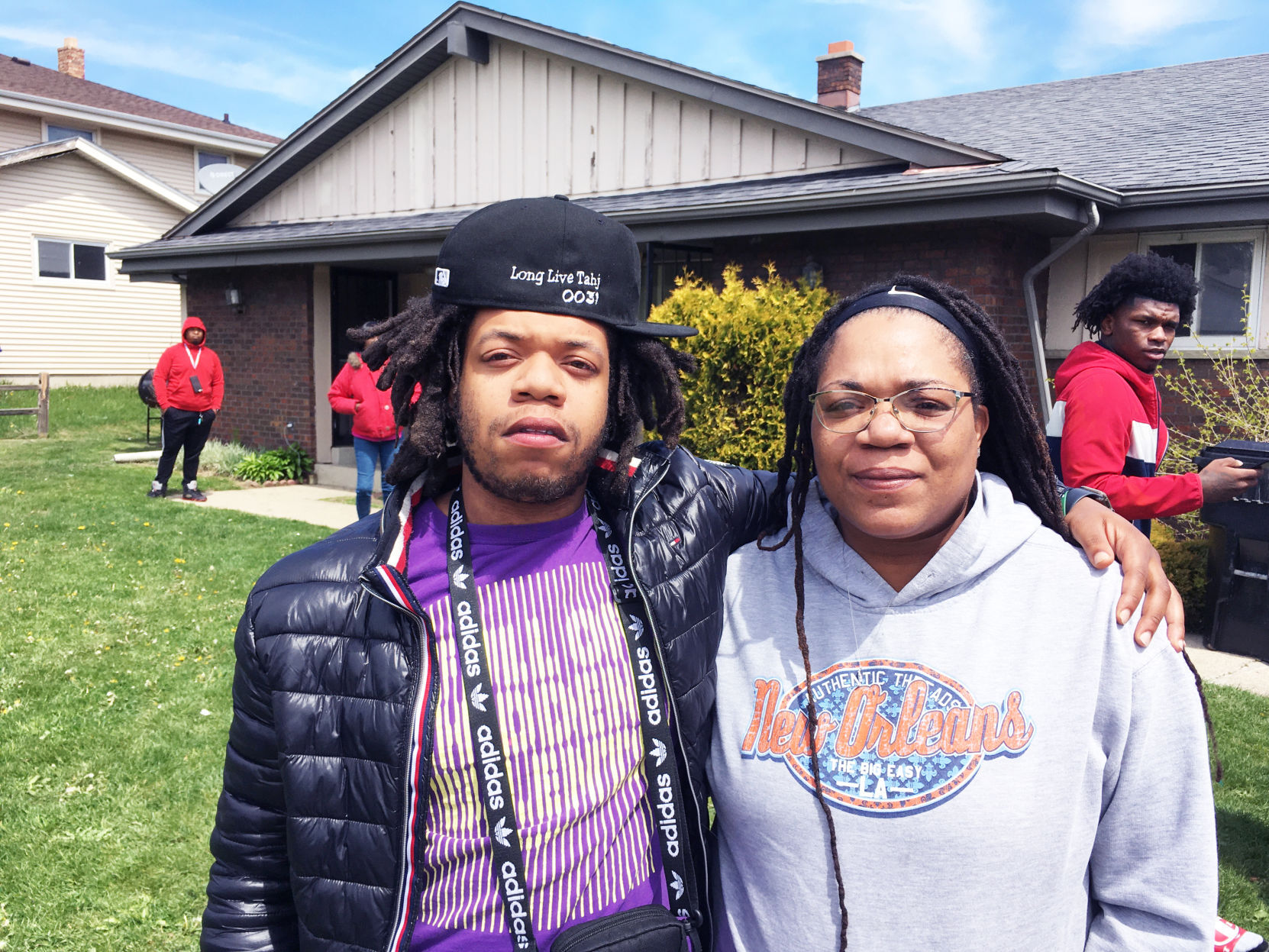 Dontrell Bush's mother and brother outside the family home